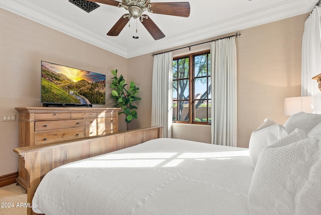 bedroom with ceiling fan and ornamental molding