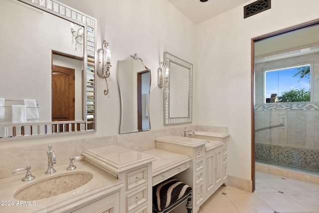 bathroom with tile flooring, an enclosed shower, and vanity