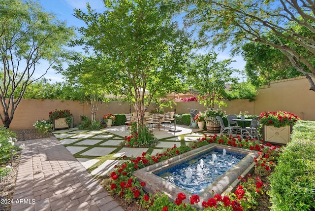 exterior space featuring a jacuzzi and a patio area