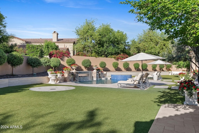 view of yard featuring a patio and a fenced in pool