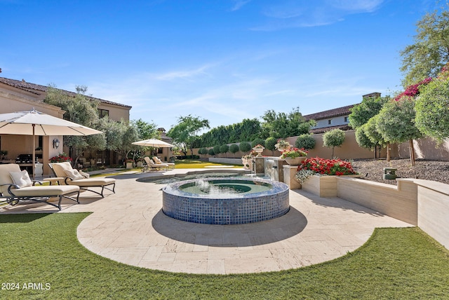 view of terrace with a pool with hot tub