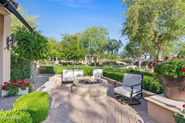 deck featuring a patio and an outdoor fire pit