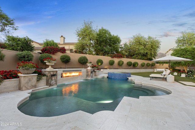 view of swimming pool featuring a patio and pool water feature