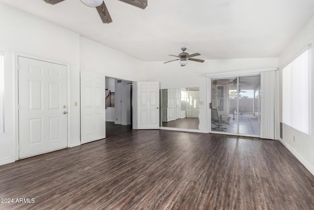 interior space featuring dark hardwood / wood-style flooring, ceiling fan, and lofted ceiling