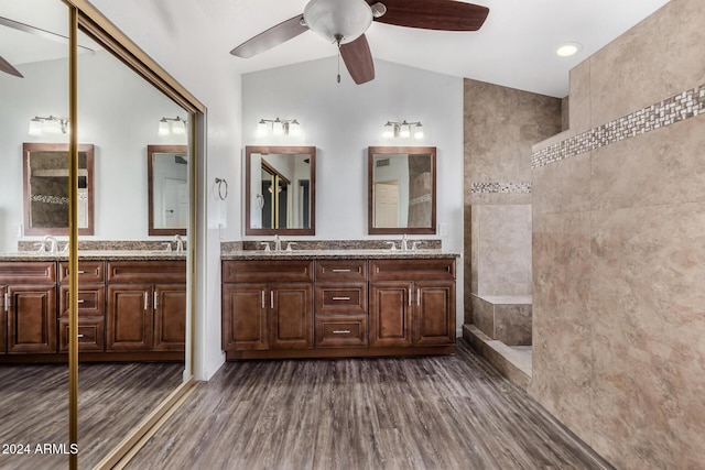 bathroom featuring ceiling fan, vanity, lofted ceiling, and hardwood / wood-style flooring