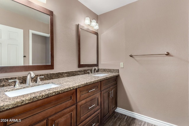 bathroom with vanity and hardwood / wood-style flooring