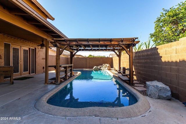 view of swimming pool with a pergola, a patio area, and french doors