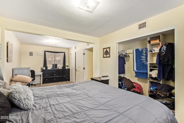 7259 E Glencove St, Mesa, AZ 85207 - bedroom with a textured ceiling, a closet, and a walk in closet