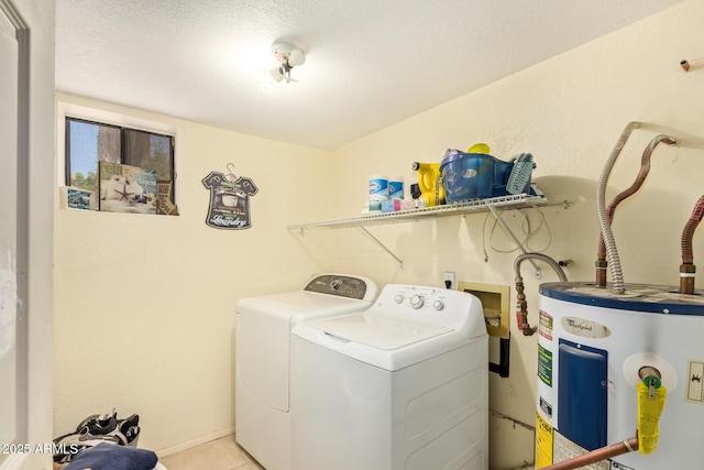 7259 E Glencove St, Mesa, AZ 85207 - laundry room featuring water heater, washer and dryer, a textured ceiling, and light tile patterned floors