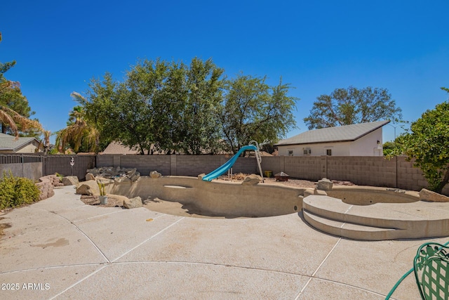 7259 E Glencove St, Mesa, AZ 85207 - fenced backyard featuring a playground and a patio area