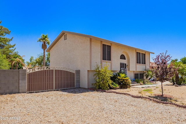 7259 E Glencove St, Mesa, AZ 85207 - view of side of home featuring stucco siding and a gate