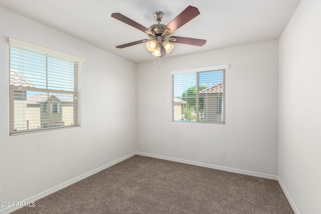 carpeted empty room featuring ceiling fan