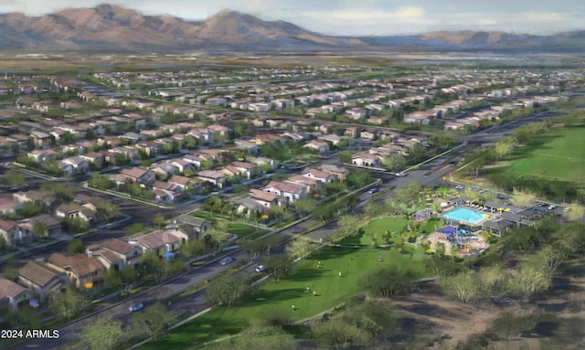 drone / aerial view featuring a residential view and a mountain view