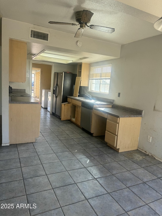 kitchen with a ceiling fan, visible vents, light brown cabinetry, dishwasher, and fridge with ice dispenser