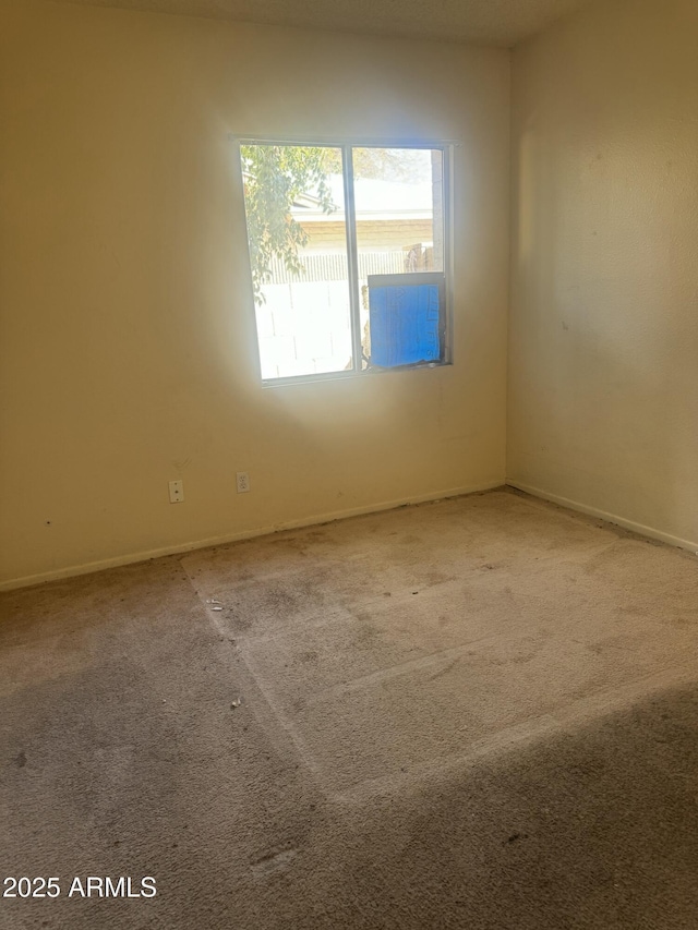 empty room featuring carpet flooring