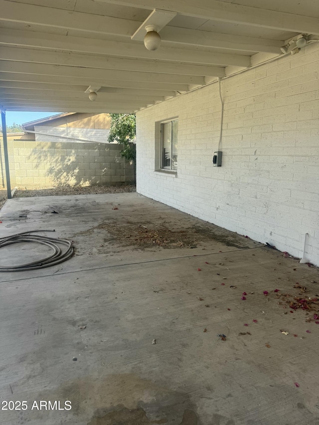 view of patio / terrace featuring fence