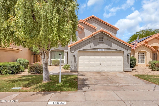 16622 S 32nd Pl, Phoenix, AZ 85048 - view of front of home featuring a tiled roof, a garage, driveway, and stucco siding