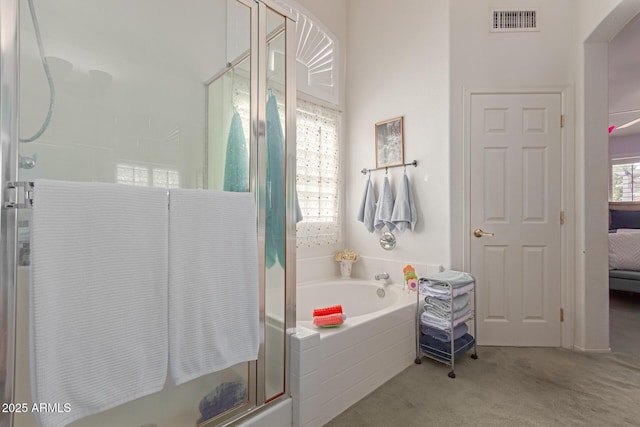 full bathroom with visible vents, connected bathroom, a shower stall, and a garden tub