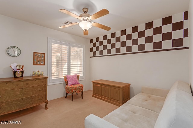 interior space featuring visible vents, ceiling fan, and light carpet