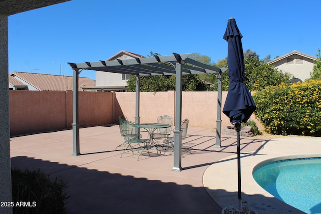 view of swimming pool featuring a fenced in pool, fence, a patio, and a pergola