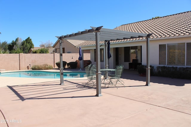 view of swimming pool featuring a patio area, fence, a fenced in pool, and a pergola