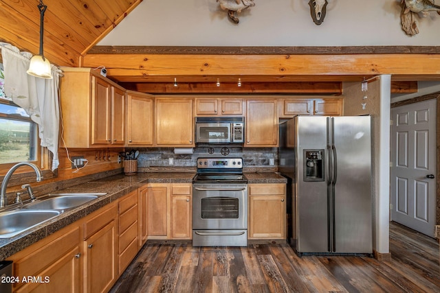 kitchen featuring stainless steel appliances, sink, dark hardwood / wood-style flooring, decorative light fixtures, and backsplash