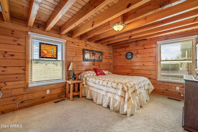 carpeted bedroom featuring multiple windows, beam ceiling, wood walls, and wood ceiling