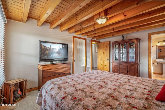 bedroom with beamed ceiling and ensuite bathroom