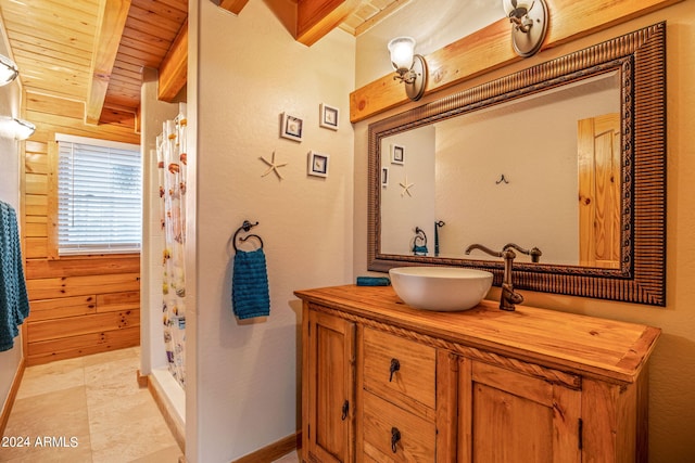 bathroom featuring a shower with curtain, vanity, wooden ceiling, beam ceiling, and wood walls