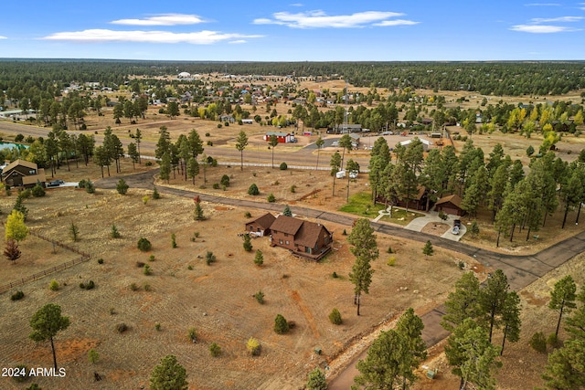 birds eye view of property with a rural view