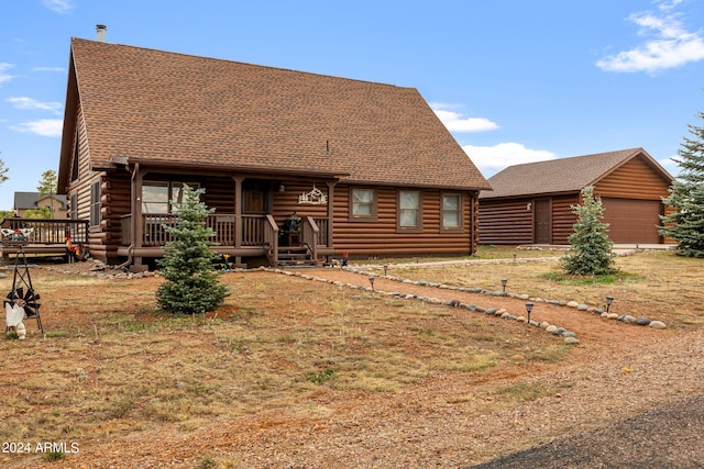 back of property featuring a garage