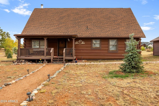 log home with covered porch