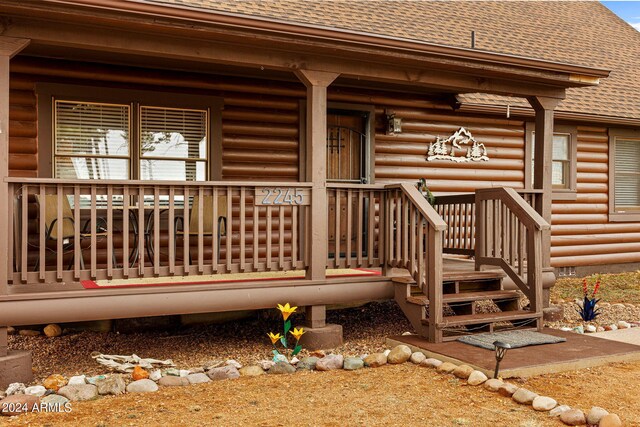 doorway to property with a porch