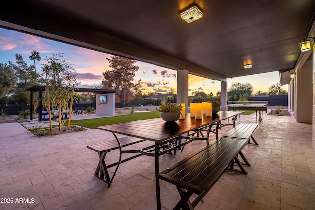8001 E Voltaire Ave, Scottsdale, AZ 85260 - patio terrace at dusk featuring a patio and outdoor dining area