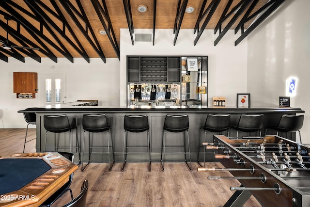 8001 E Voltaire Ave, Scottsdale, AZ 85260 - indoor wet bar with beamed ceiling and wood finished floors