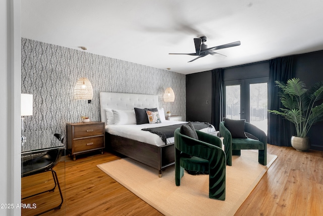 8001 E Voltaire Ave, Scottsdale, AZ 85260 - bedroom featuring wallpapered walls, an accent wall, wood finished floors, french doors, and access to outside