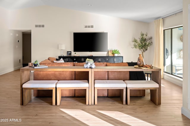 8001 E Voltaire Ave, Scottsdale, AZ 85260 - living room with vaulted ceiling and wood finished floors