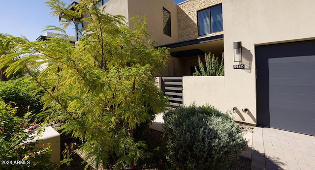 view of property exterior featuring a garage