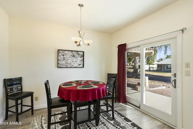 dining room featuring a chandelier and hardwood / wood-style flooring