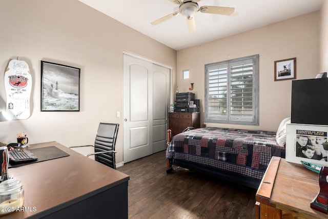 bedroom with ceiling fan, dark hardwood / wood-style flooring, and a closet