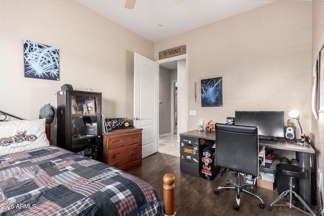 bedroom with ceiling fan and dark hardwood / wood-style flooring