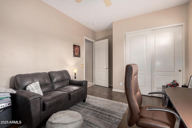 office area with dark wood-type flooring and ceiling fan