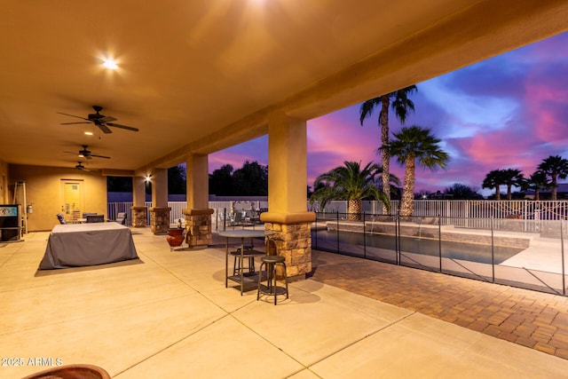 patio terrace at dusk with ceiling fan