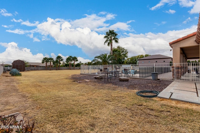 view of yard with a storage shed