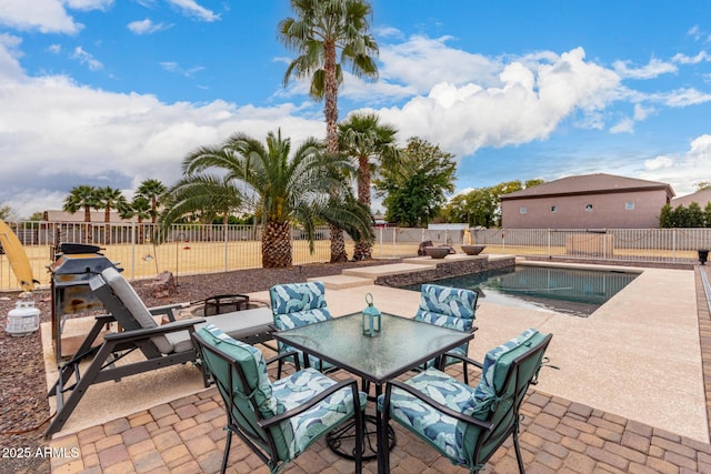 view of patio / terrace with a fenced in pool