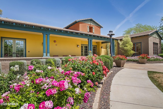 exterior space featuring french doors and covered porch