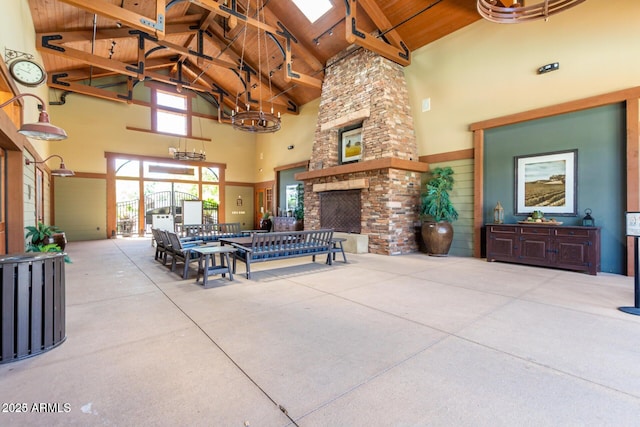 view of patio with a stone fireplace