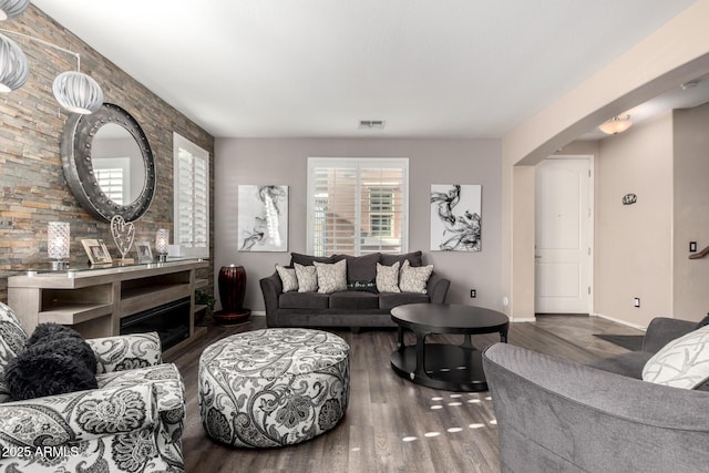 living room with dark hardwood / wood-style flooring