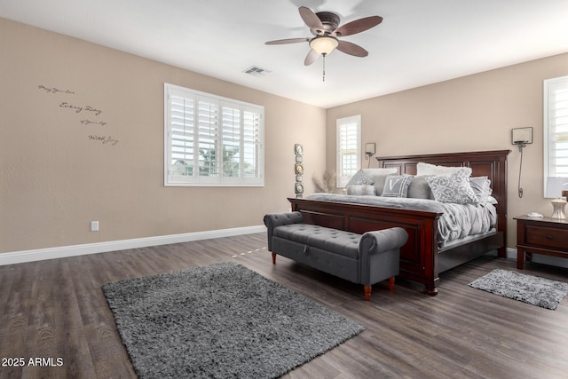 bedroom with ceiling fan and dark wood-type flooring