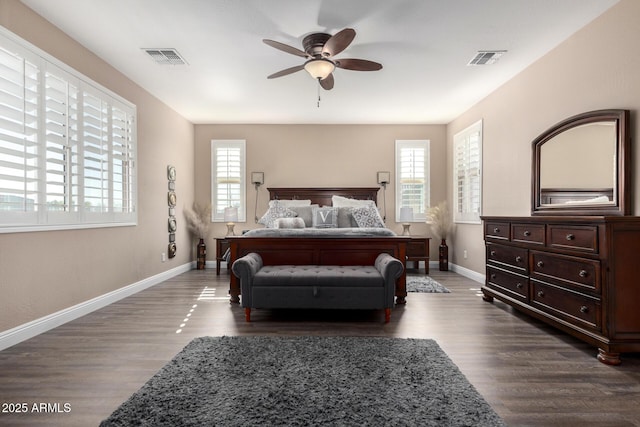 bedroom featuring ceiling fan and dark hardwood / wood-style flooring